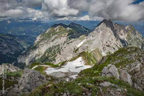 Between Italy and Austria: on the top of mountain near Volaia Lake Raunchkofer Mountain (Lago di Volaia Monte). Mountain hiking Trail Road.