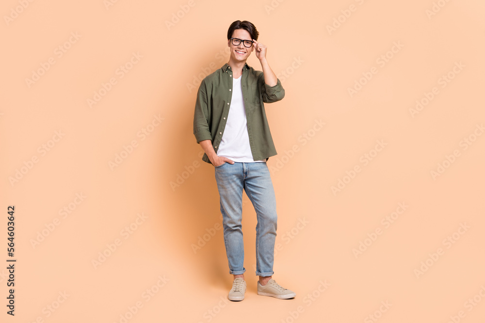 Full body length size cadre of young optimistic man wear stylish outfit  casual style new eyeglasses advertisement isolated on beige color  background Stock Photo | Adobe Stock