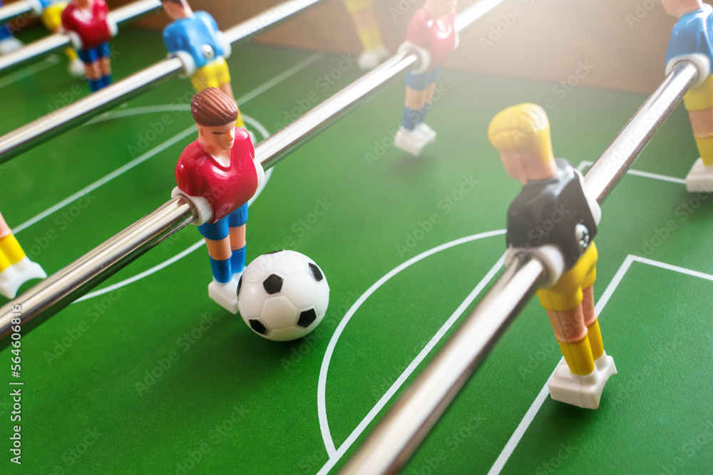Close-up view of a table football game in progress Close-up view of a table football game in progress