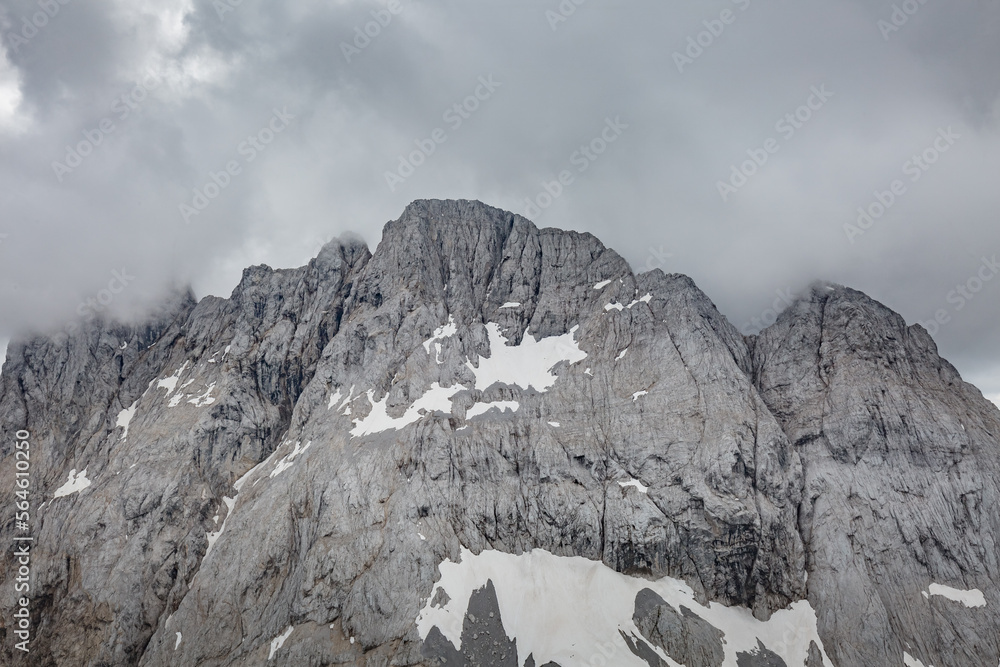 Between Italy and Austria: on the top of mountain near Volaia Lake Raunchkofer Mountain (Lago di Volaia Monte). Mountain hiking Trail Road. Between Italy and Austria: on the top of mountain near Volaia Lake Raunchkofer Mountain (Lago di Volaia Monte). Mountain hiking Trail Road.
