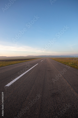 Small empty field airport with asphalt runway