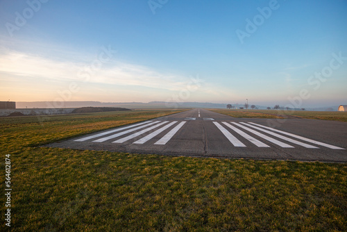 Small empty field airport with asphalt runway