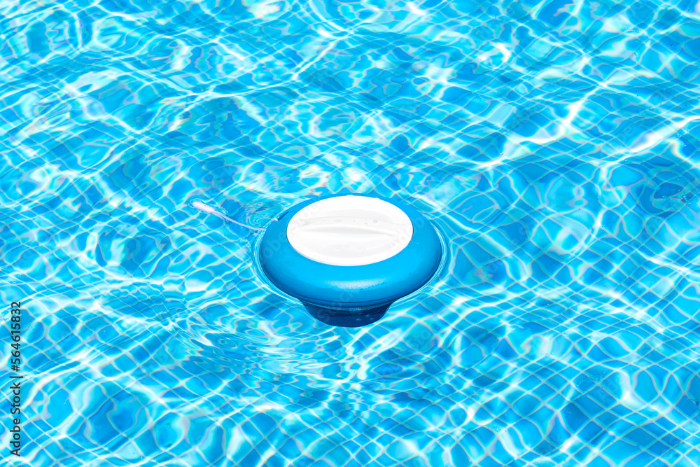 Floating pool skimmer adding chlorine to the water for disinfection and