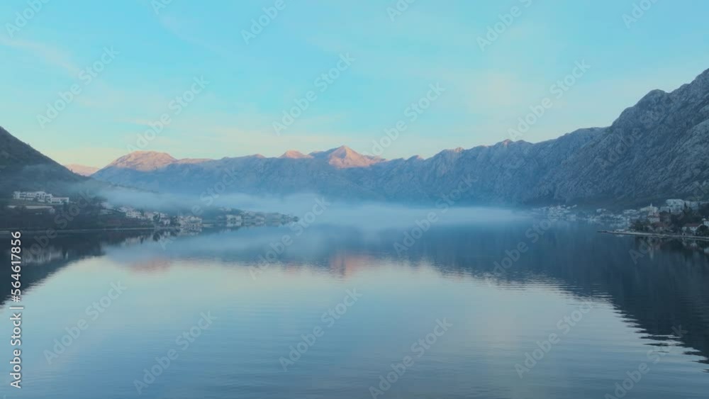 Fog in the Kotor bay. Aerial view. mountains in the background. Early morning time in a winter season. Fog in the Kotor bay. Aerial view. mountains in the background. Early morning time in a winter season.
