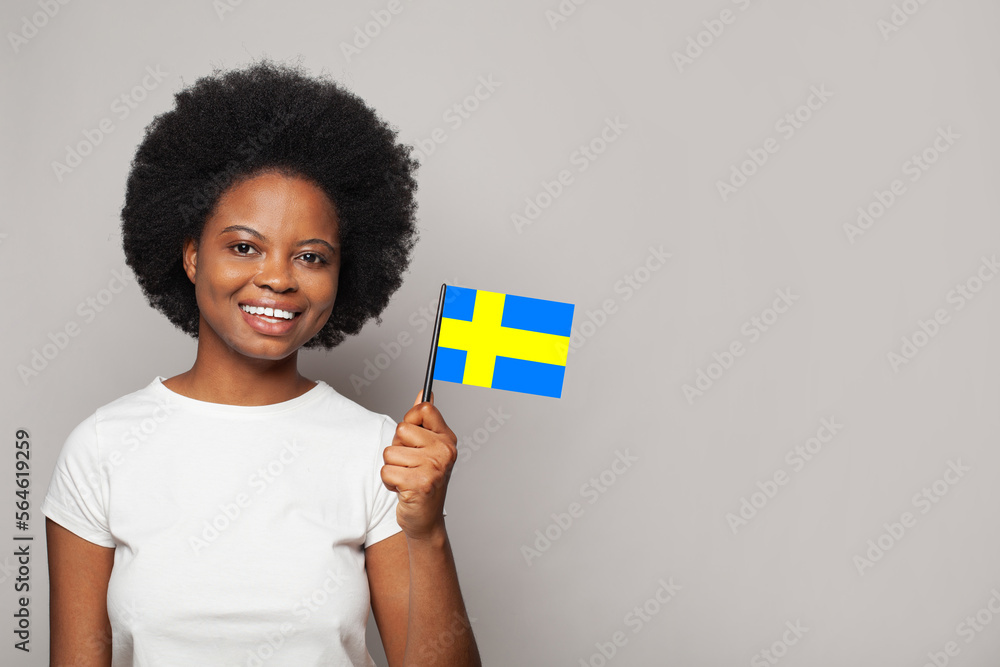 Swedish woman holding flag of Sweden Education, business, citizenship and patriotism concept Swedish woman holding flag of Sweden Education, business, citizenship and patriotism concept