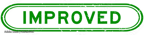 Grunge green improved word rubber seal stamp on white background
