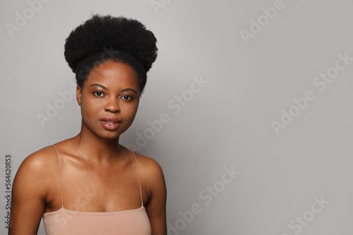 Perfect woman with fresh clean skin posing on white studio wall background. Beauty, facial treatment, skin care and wellness concept