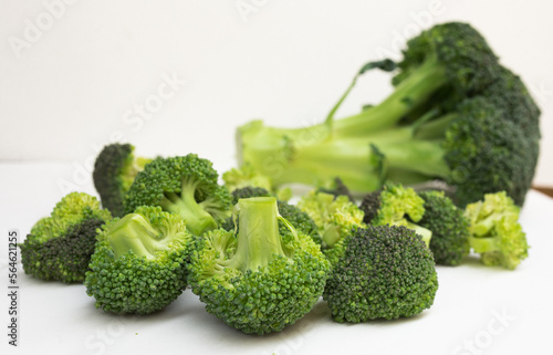 fresh broccoli and florets on white background