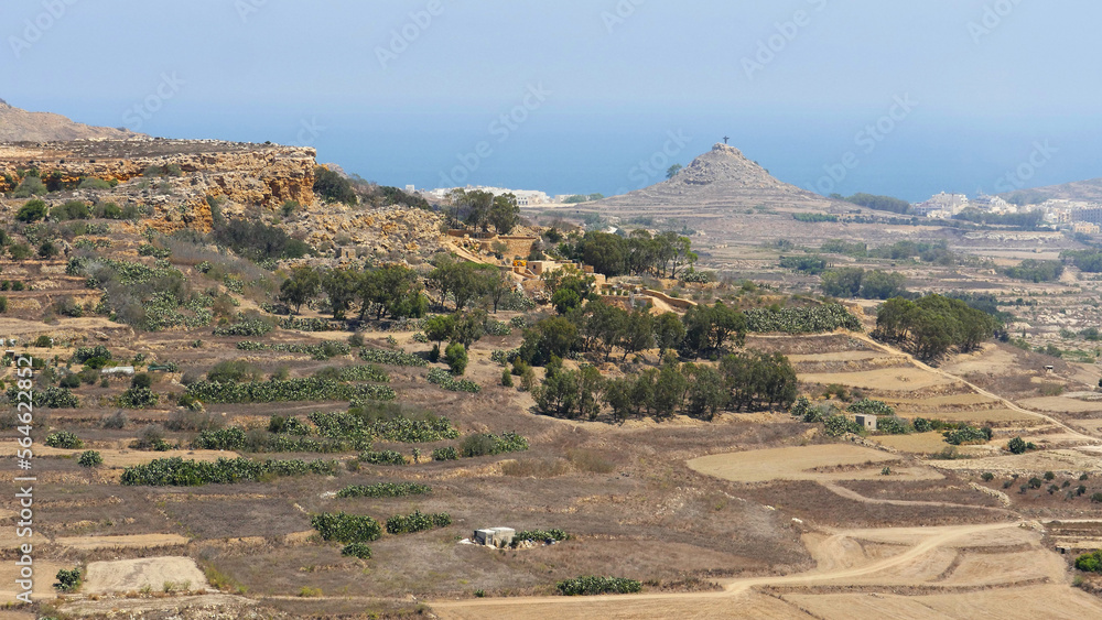 The dusty view across the small island of Gozo, Malta from the citadel, in Victoria The dusty view across the small island of Gozo, Malta from the citadel, in Victoria
