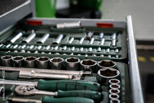 Equipment for auto mechanic. Metal cabinets with drawers. Tools for car repair at a service station