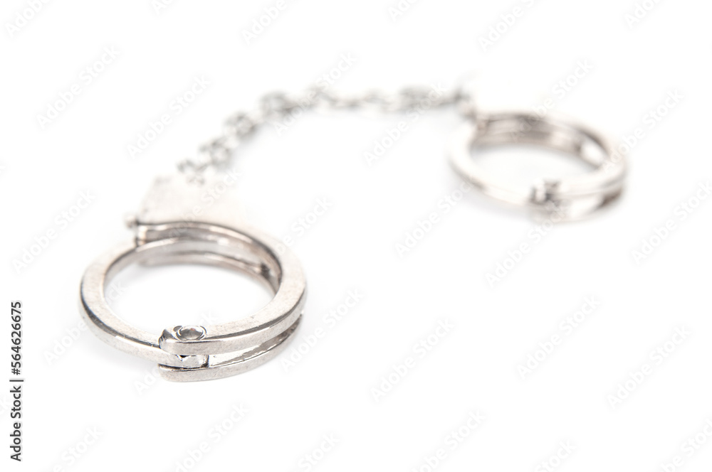 Metal handcuffs on a white background Metal handcuffs on a white background