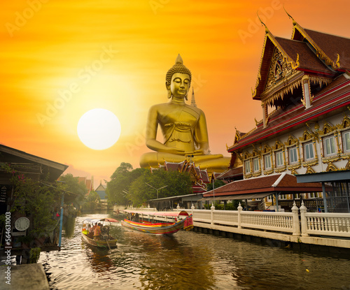 Big Buddha  Wat Paknam  at sunset. Chao Phraya river canal cruise. Tourists traveling by traditional boats. Thailand s most important travel destinations. Bangkok  Thailand 