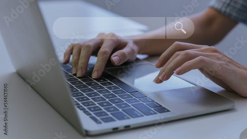 Woman hand using laptop or computor searching for information in internet online society web. Searching information data on internet networking concept. Data Search Search Engine Optimization.