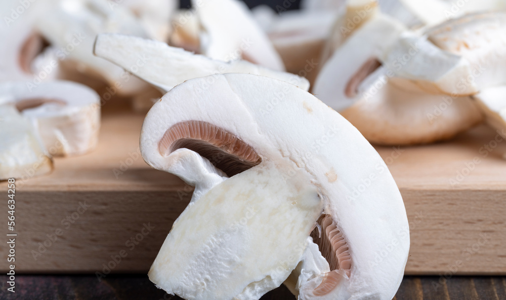 Sliced mushrooms on a board Sliced mushrooms on a board