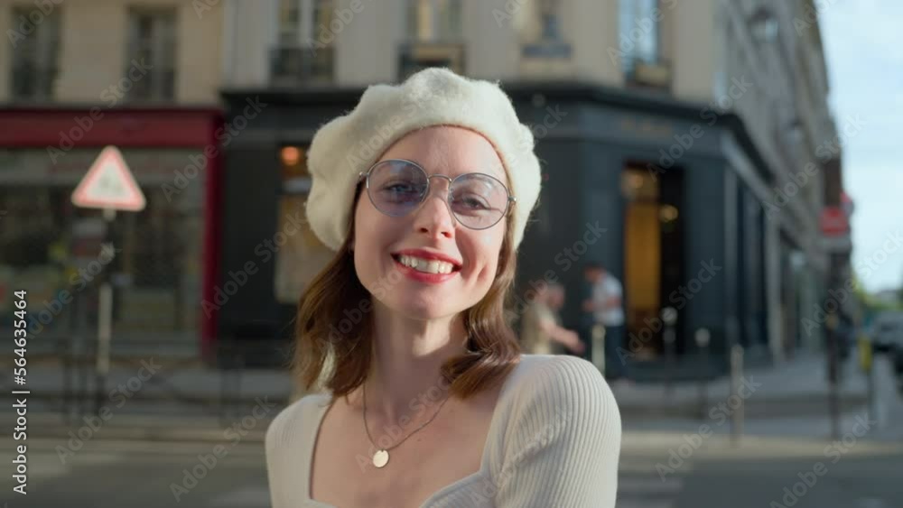 Young smiling girl looking at camera on Parisian street Young smiling girl looking at camera on Parisian street