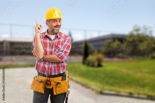 Positive man making pointing gesture with finger