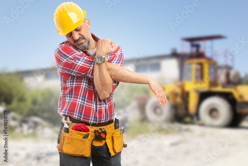 Tired male worker stretching his arms photo