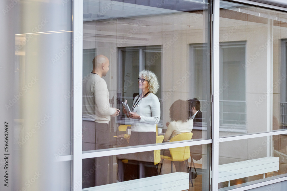 Business people talking in office Business people talking in office