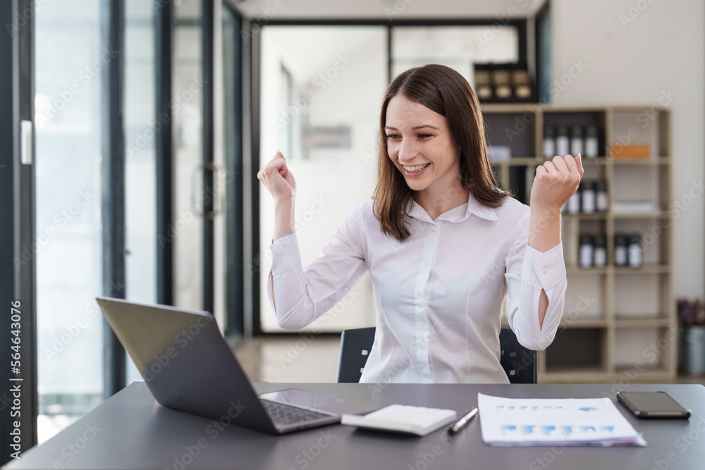 Business people happy to be successful partnership teamwork celebrating achievement and success concept. Beautiful business woman celebrate with laptop Business people happy to be successful partnership teamwork celebrating achievement and success concept. Beautiful business woman celebrate with laptop
