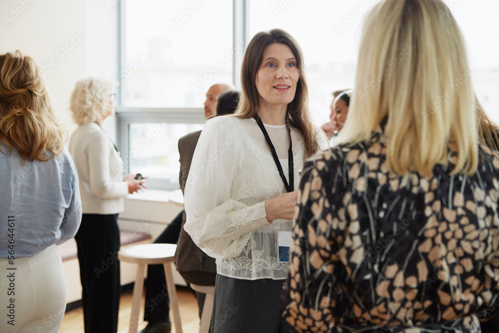 Businesswomen talking during coffee break Businesswomen talking during coffee break