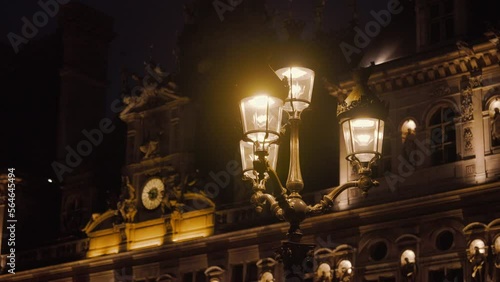 Lantern on the background of a historic building with the French flag