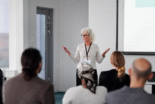Woman having presentation during business meeting photo