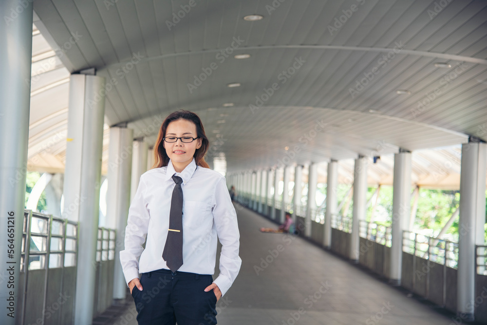 Portrait happiness businessman smiling face confident leader manager in modern city. Asian woman success look at camera smile professional manager. Women standing suit happy CEO leader business Portrait happiness businessman smiling face confident leader manager in modern city. Asian woman success look at camera smile professional manager. Women standing suit happy CEO leader business