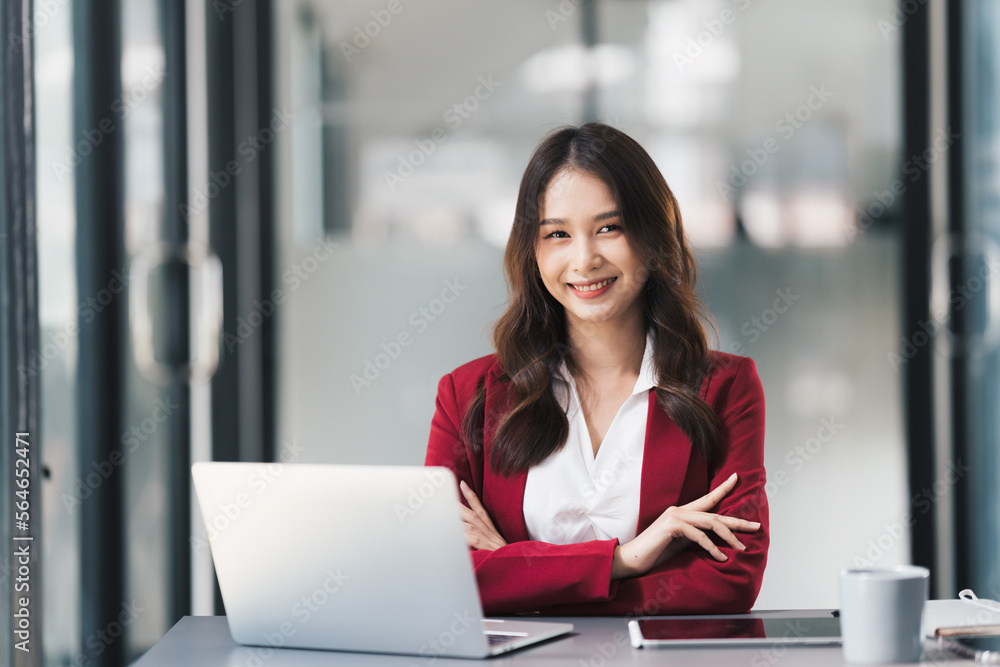 Young beautiful businesswoman working on her project in modern office room. Young beautiful businesswoman working on her project in modern office room.