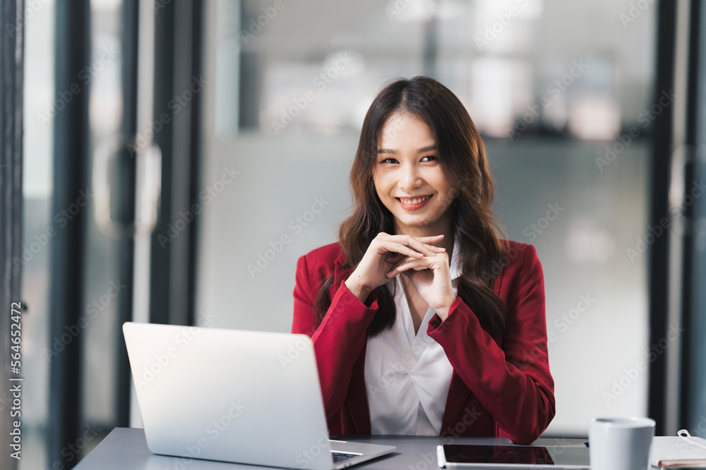 Young beautiful businesswoman working on her project in modern office room. Young beautiful businesswoman working on her project in modern office room.