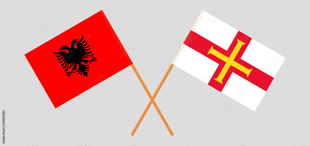 Crossed flags of Albania and Bailiwick of Guernsey. Official colors. Correct proportion