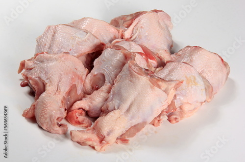 Fresh chicken skeletons on a white background. Raw chicken backs skin on bone. Fresh Chicken Back
