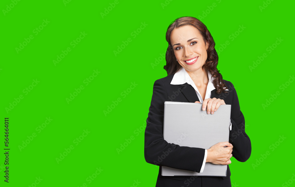 Portrait image of happy smiling young business woman black confident suit with grey folder. Executive office worker, teacher or real estate agent. Green chroma key background. Portrait image of happy smiling young business woman black confident suit with grey folder. Executive office worker, teacher or real estate agent. Green chroma key background.