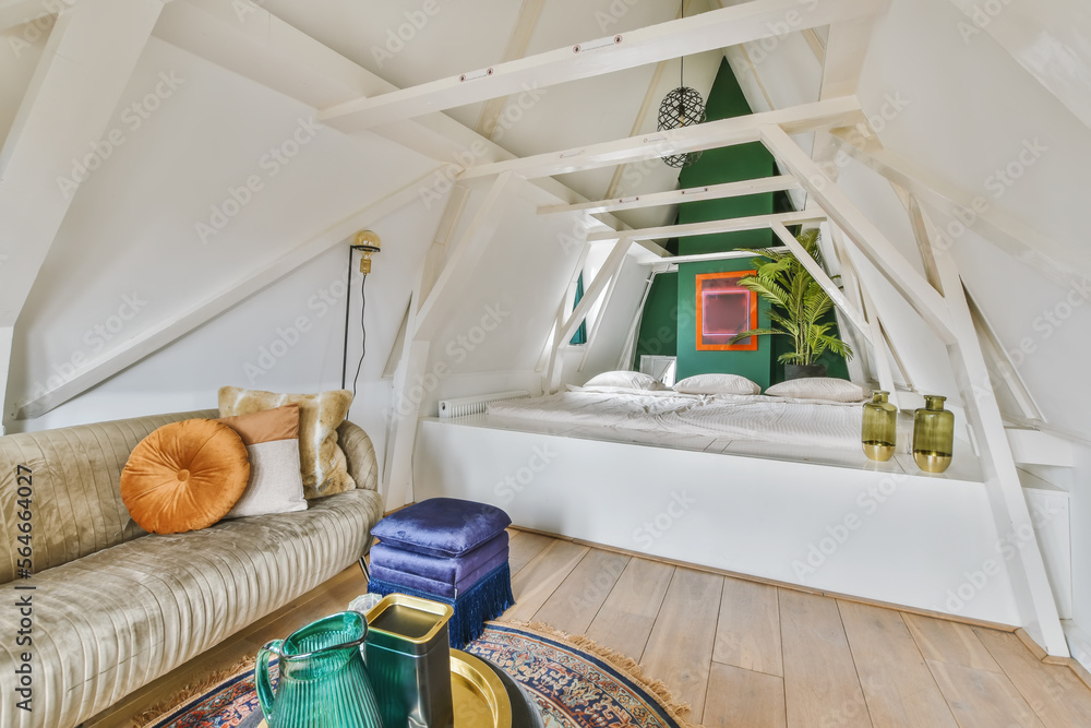 Bedroom interior with bed and sofa on attic Stock Photo | Adobe Stock