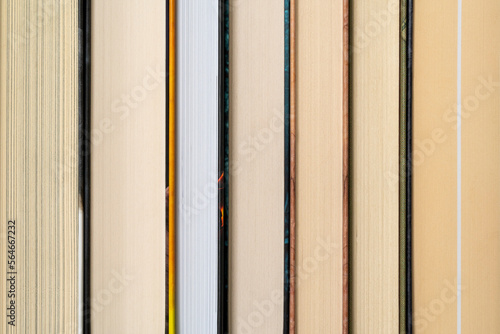 Different hardcover books in a row