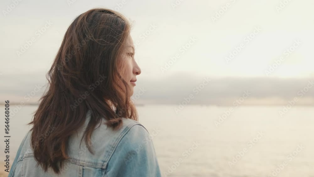 Young beautiful woman enjoying the seascape Young beautiful woman enjoying the seascape