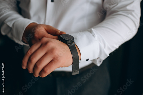 Time is money. Businessman pointing on watch. Business concept.