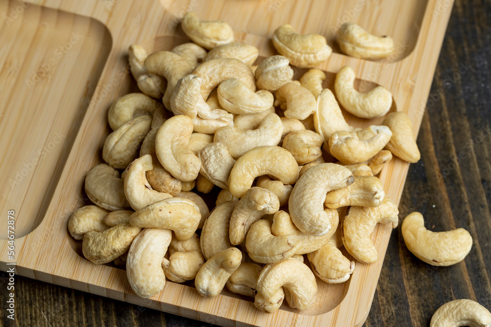 Hard roasted and peeled cashew nuts on the table Hard roasted and peeled cashew nuts on the table