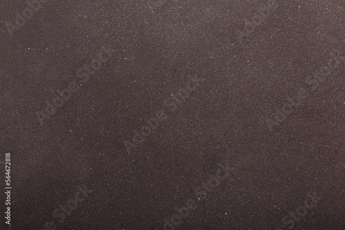 Dark grey painted wooden background with white spraying, texture, abstract backdrop, copy space