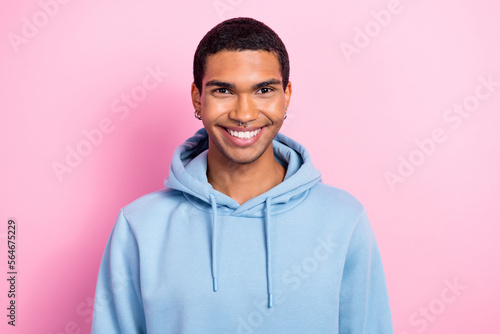 Portrait of nice cheerful person beaming toothy smile piercing isolated on pink color background