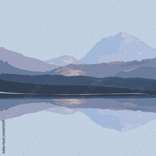 Picturesque view of a lake with mountains reflected in it under a blue sky. photo