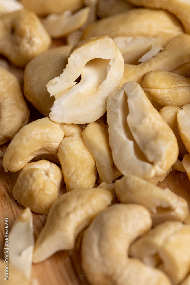 scattered pile of cashew nuts scattered pile of cashew nuts