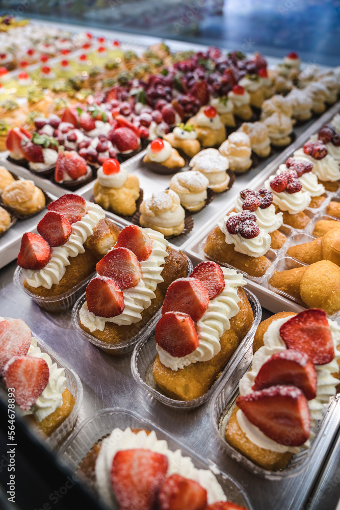 Italian Bakery counter, Window of desserts at a pastry shop. Fresh and tasty products Italian Bakery counter, Window of desserts at a pastry shop. Fresh and tasty products