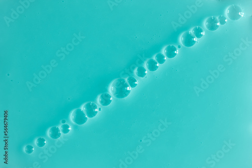 Bubble mint turquoise background texture. Berry gel to cleanse the skin of the face and body. Spa treatments, skin care. Bath foam, detergent. Slime blue