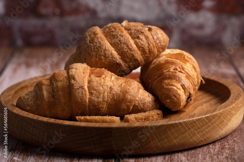 Croissants lie on the table in the kitchen 