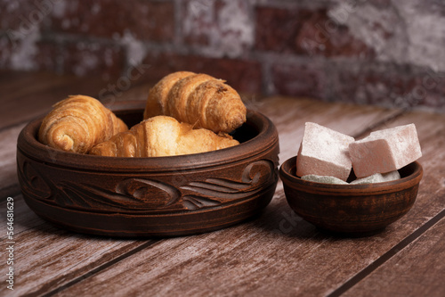 Croissants and Turkish delight on the table in the kitchen 
