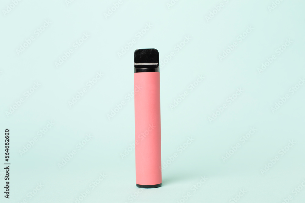Disposable electronic cigarette on color background Disposable electronic cigarette on color background