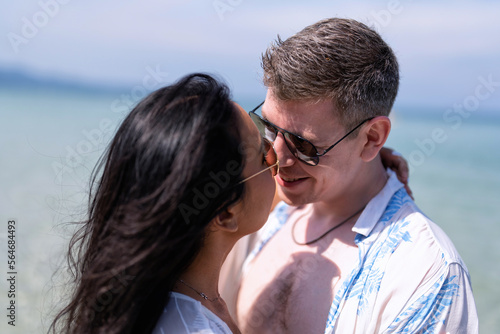 Love couple on holiday happy playing running along the beach and sweet kiss on love emotion