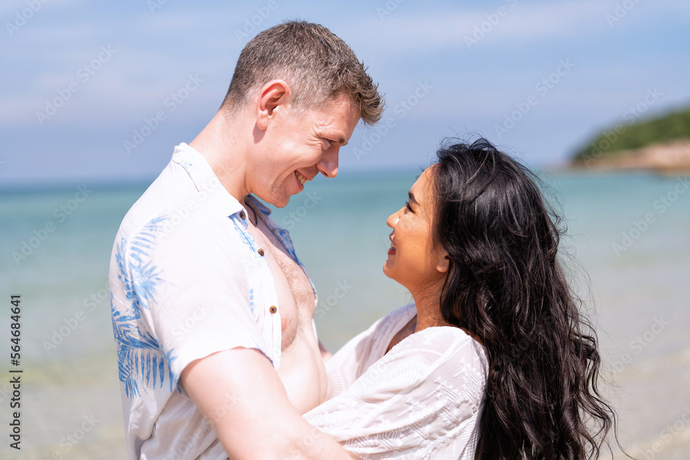 Love couple on holiday happy playing running along the beach and sweet kiss on love emotion Love couple on holiday happy playing running along the beach and sweet kiss on love emotion