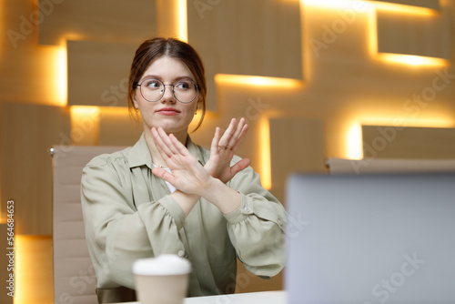 Business woman showing denial sign, no deal. Disagreement of the office worker.