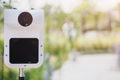 Wallpaper Mural Selective focus on white standing digital infrared thermometer in front of the garden for measure head and palm to check body temperature before entrance as a new normal during covid-19 pandemic Torontodigital.ca